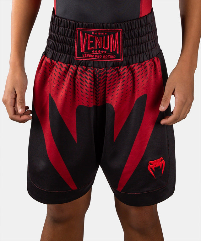 Pantaloncini da boxe Venum Attack – Bambini Nero/Rosso