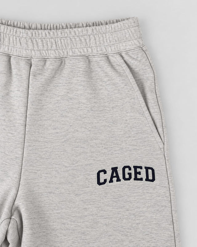 Pantalones de entrenamiento Caged Varsity – Gris Melange