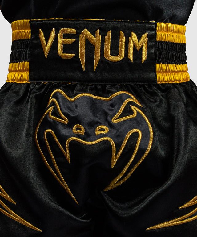 Calções de Muay Thai Venum Bangkok Fury Criança – Preto/Ouro