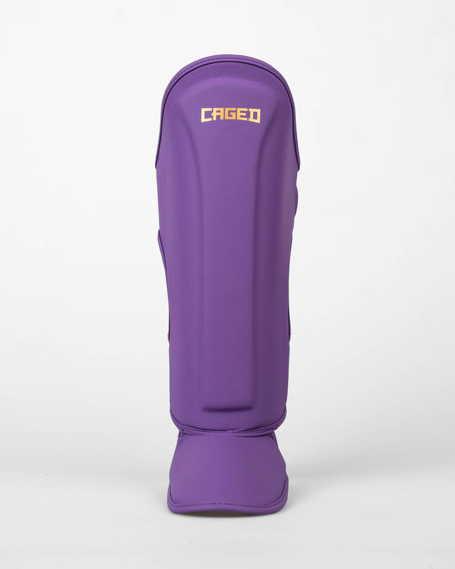 Caged Spark Kids Shin Guards – Purple/Gold