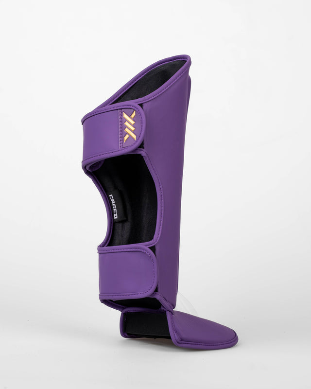 Caged Spark Kids Shin Guards – Purple/Gold