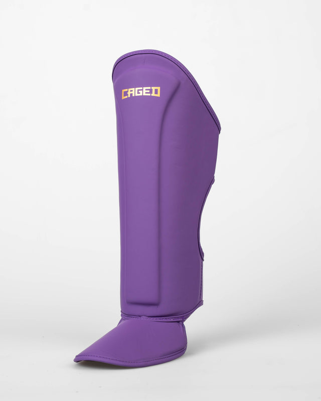 Caged Spark Kids Shin Guards – Purple/Gold