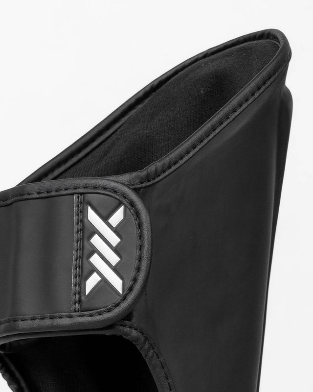 Caged Spark Kids Shin Guards – Matte Black/White