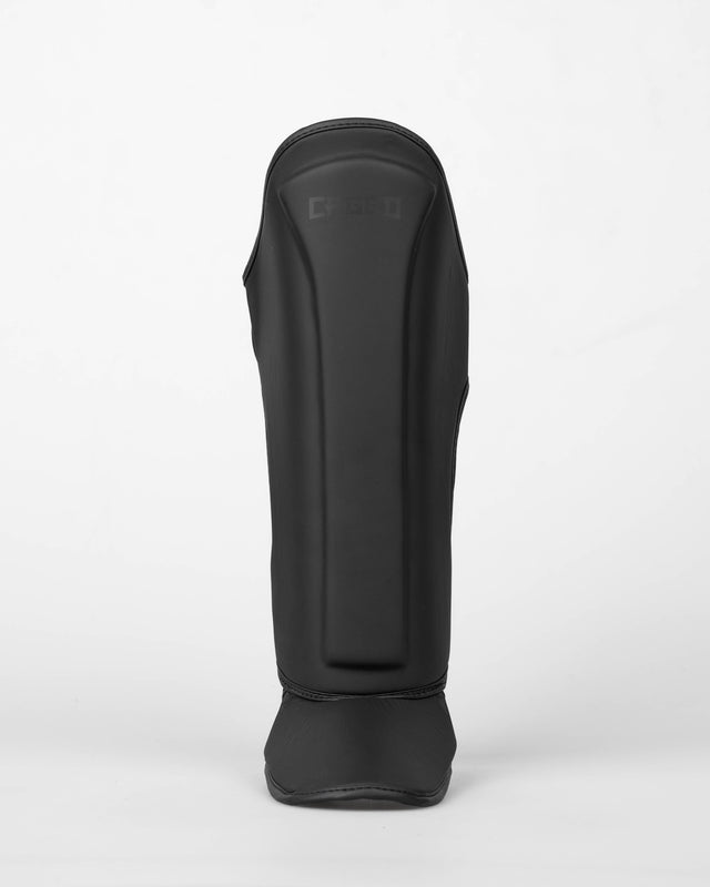 Protège-tibias Caged Spark Enfant – Noir mat