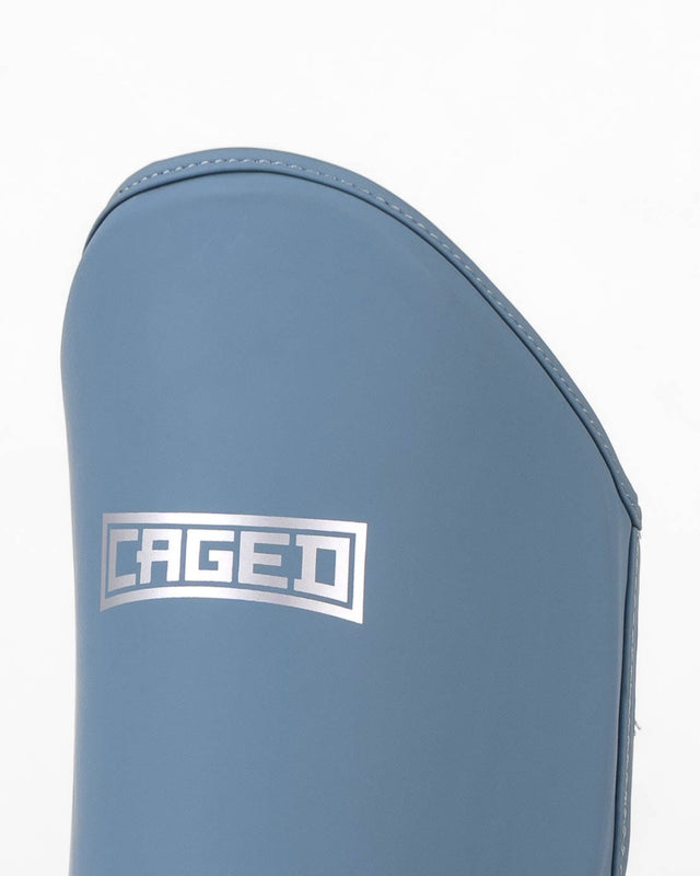 Espinilleras Caged Shadow - Midnight Blue