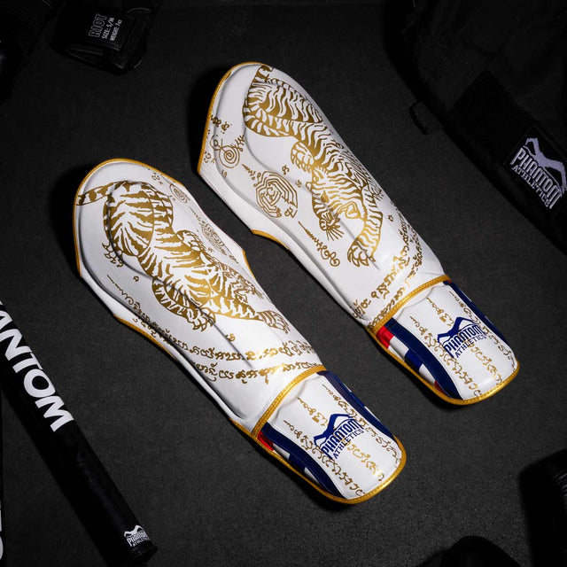 Protège-tibias Phantom Athletics Muay Thai – Blanc/Or