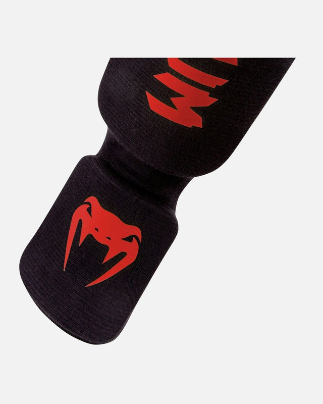 Espinilleras Venum Kontact – Negro/Rojo