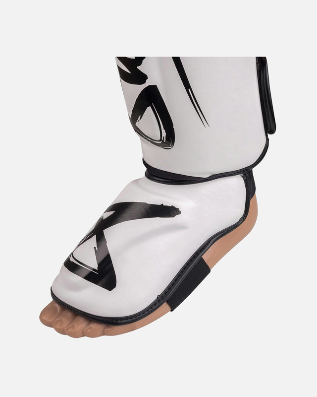 Espinilleras 8 WEAPONS Unlimited 2.0 – Blanco/Negro