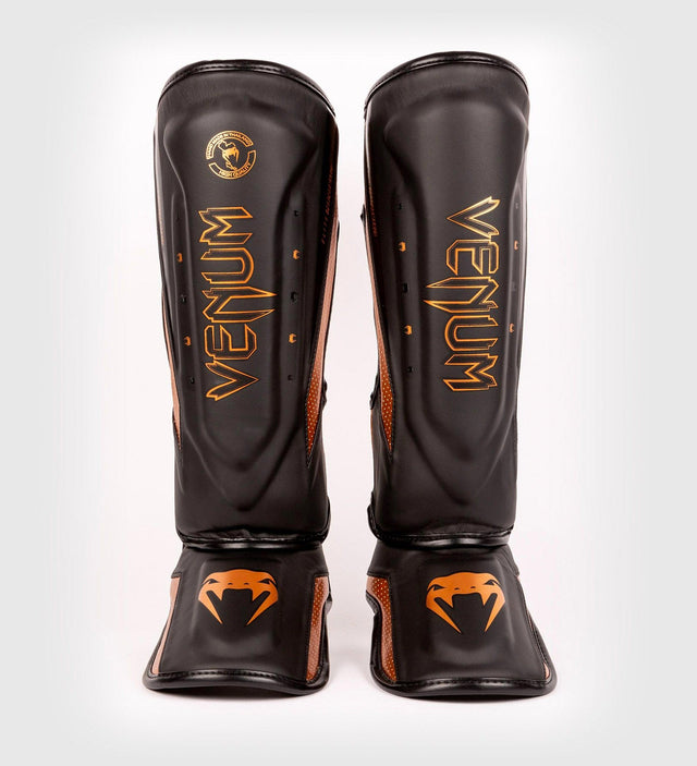 Protège-tibias Venum Elite Evo – Noir/Bronze – Protège-tibias