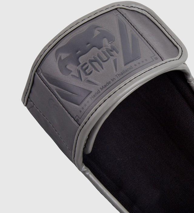 Espinilleras Venum Elite – Gris