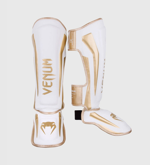 Espinilleras Venum Elite – Blanco/Oro