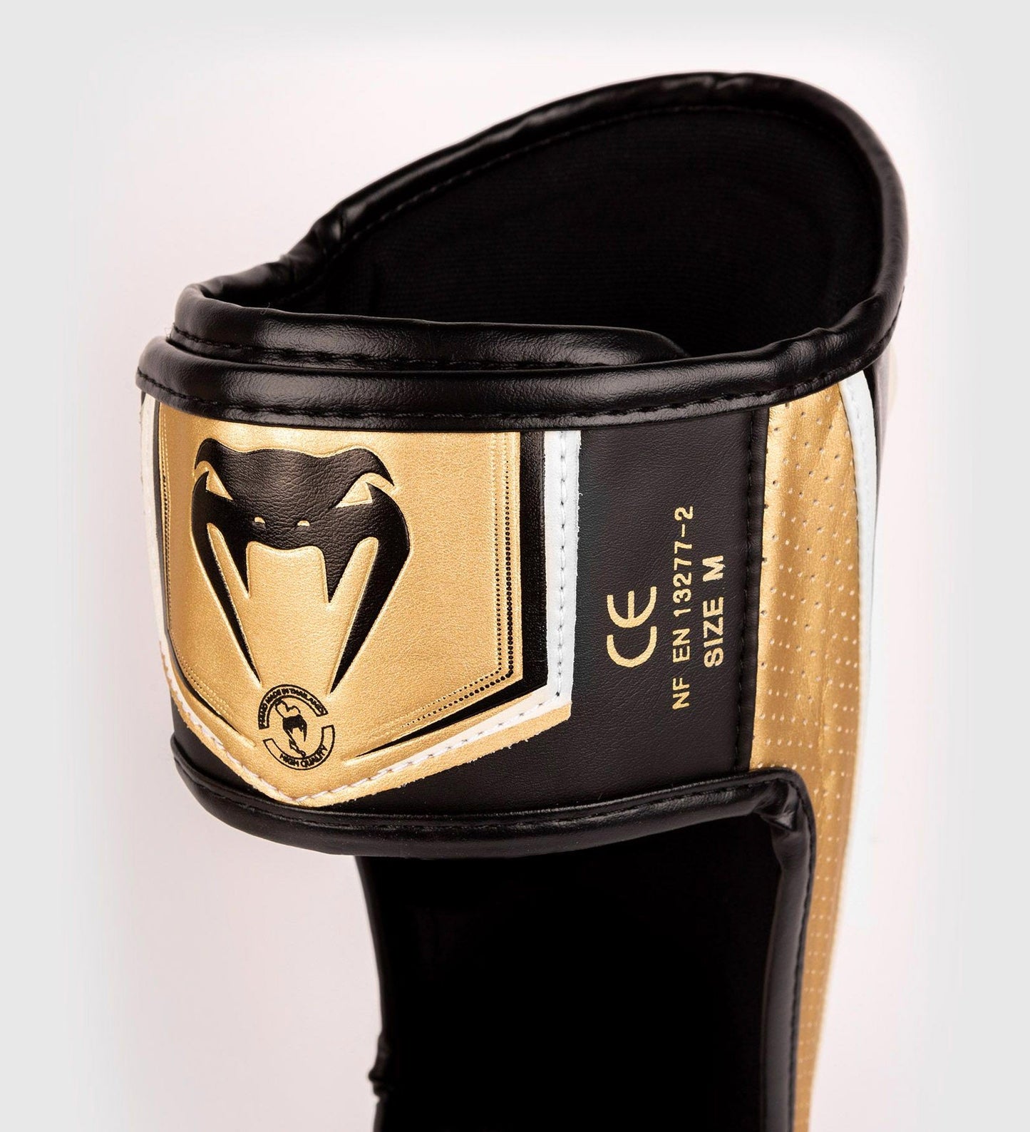 Protège-tibias Venum Elite Evo - Blanc/Doré