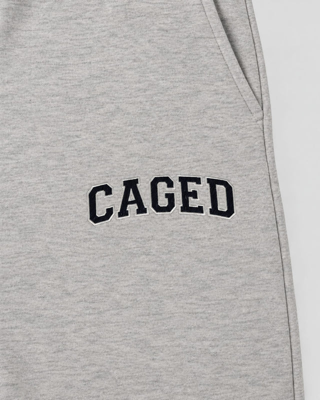 Pantalones de entrenamiento Caged Varsity – Gris Melange