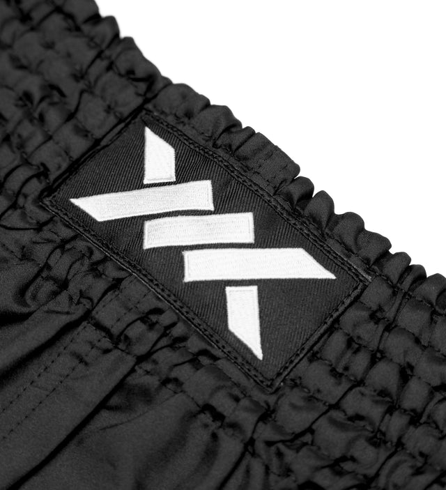 Caged Muay-Thai-Shorts Classic – Schwarz/Weiß