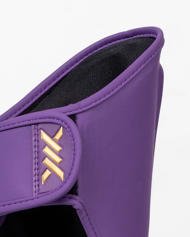 Caged Spark Kids Shin Guards – Purple/Gold