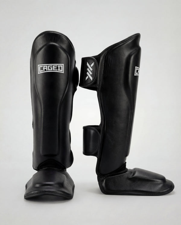 Espinilleras Caged 'X' Series – Negro/Blanco