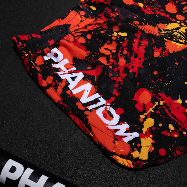 Phantom Athletics MMA-Shorts Fusion Splatter – Rot/Orange