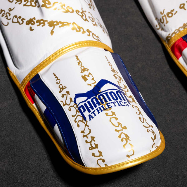 Protège-tibias Phantom Athletics Muay Thai – Blanc/Or
