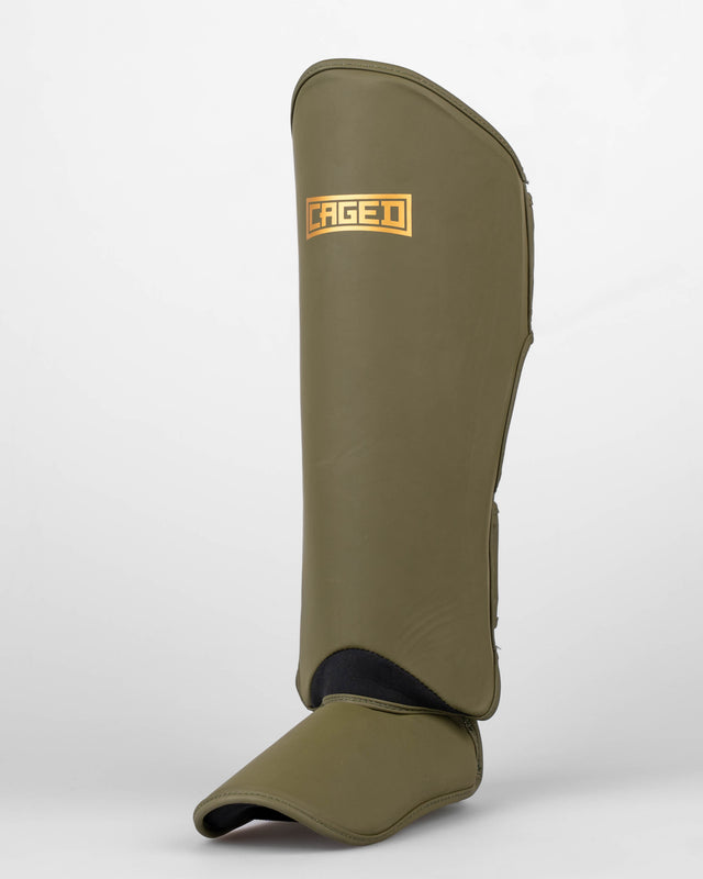 Caged Schienbeinschoner Shadow – Khaki Grün/Gold