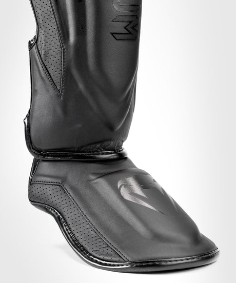 Espinilleras Venum Elite Evo – Negro/Negro
