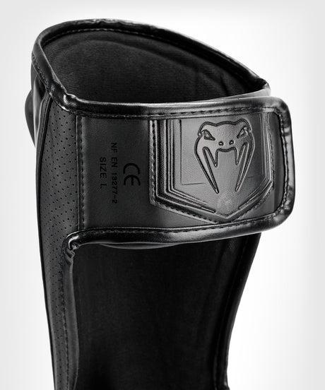 Espinilleras Venum Elite Evo – Negro/Negro