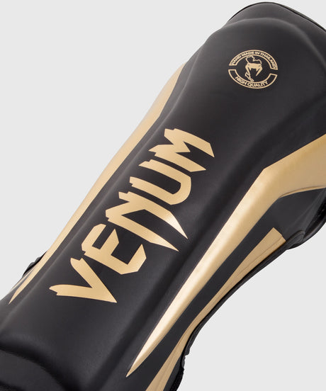 Espinilleras Venum Elite – Negro/Oro