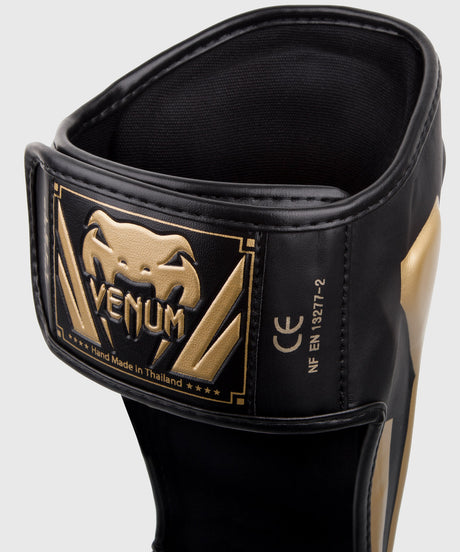 Espinilleras Venum Elite – Negro/Oro