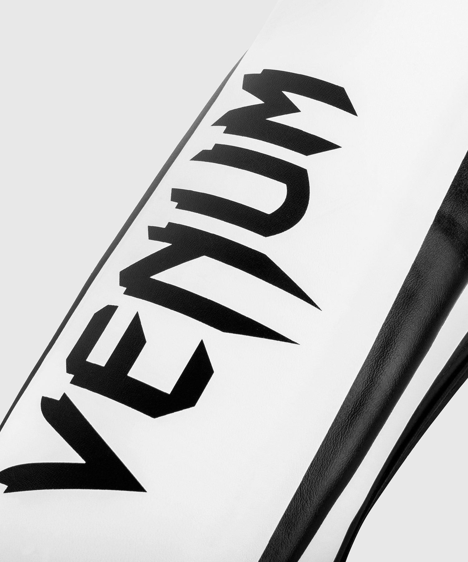 Espinilleras Venum Elite – Blanco/Negro