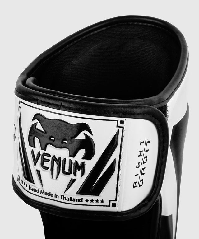 Espinilleras Venum Elite – Blanco/Negro