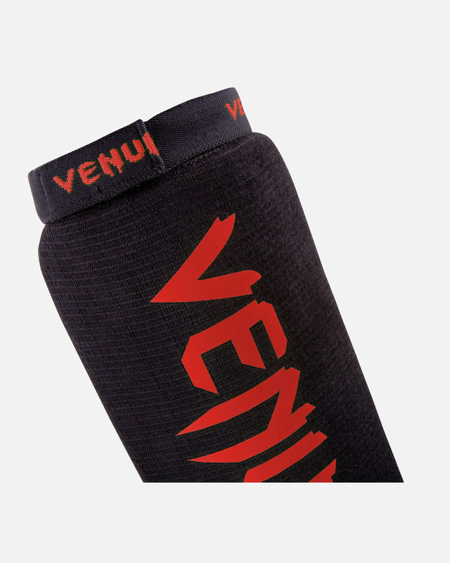 Espinilleras Venum Kontact – Negro/Rojo