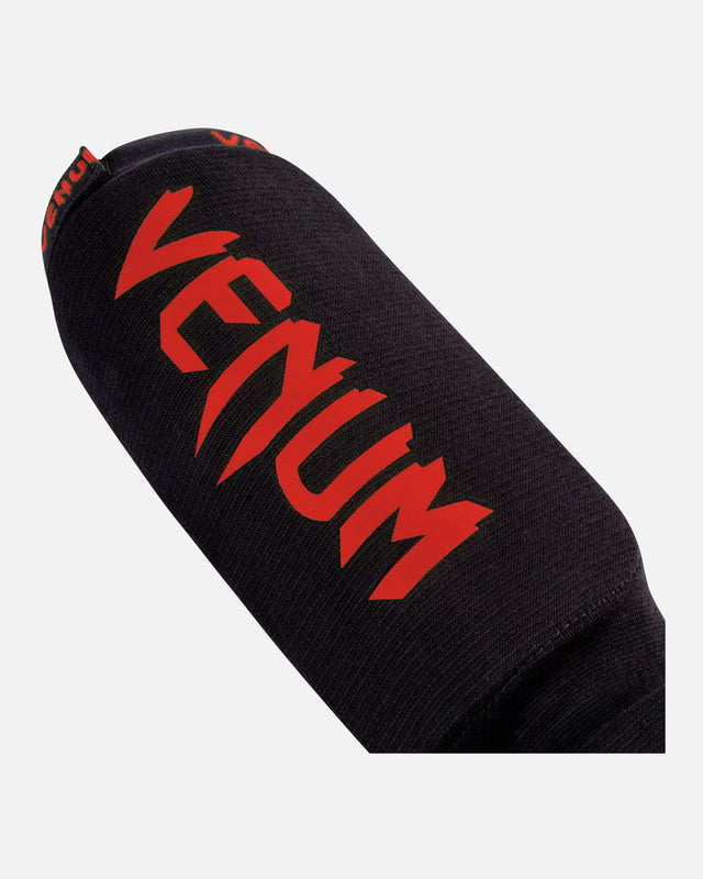 Espinilleras Venum Kontact – Negro/Rojo