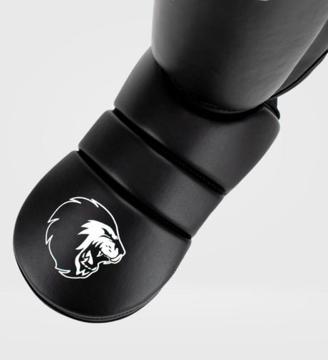 Protège-tibias Super Pro Kickboxing Protector – Noir/Blanc – Protège-tibias