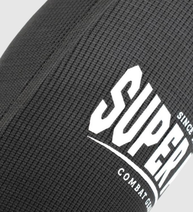 Super Pro Schienbeinschoner Defender – Schwarz/Weiß – Schienbeinschoner