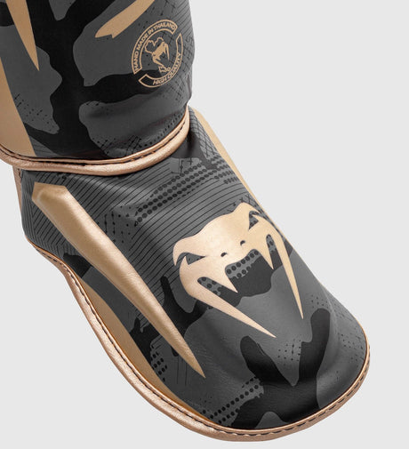 Protège-tibias Venum Elite – Gris camo/Or
