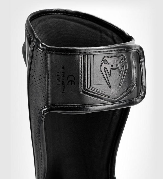 Protège-tibias Venum Elite Evo – Noir/Noir – Protège-tibias