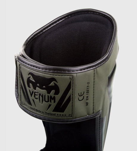 Paratibie da kickboxing Venum Elite – Verde/Nero – Paratibie