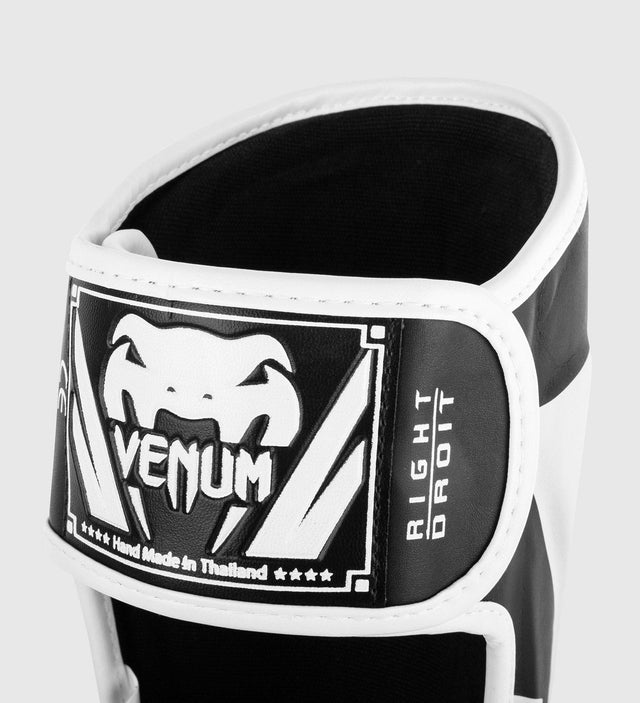 Espinilleras Venum Elite – Negro/Blanco